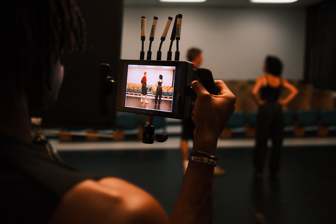 Camera monitor showing two actors rehearsing