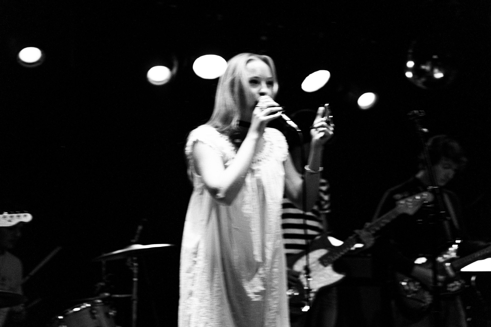 Singer on stage in motion blur, black and white