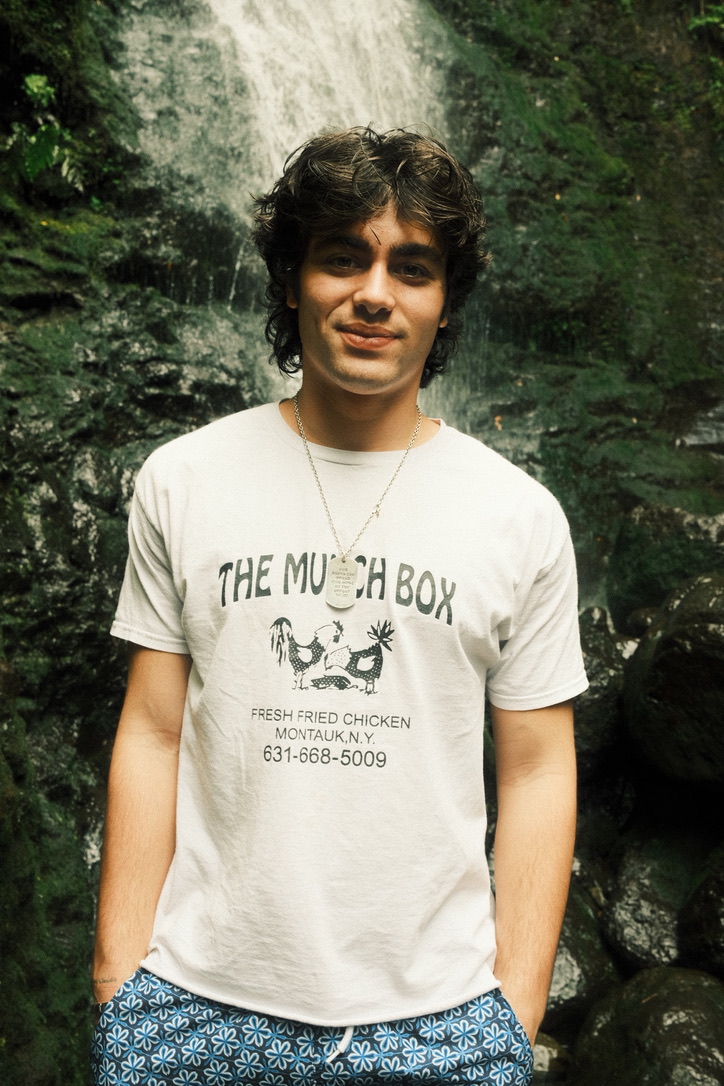 Portrait in front of a waterfall