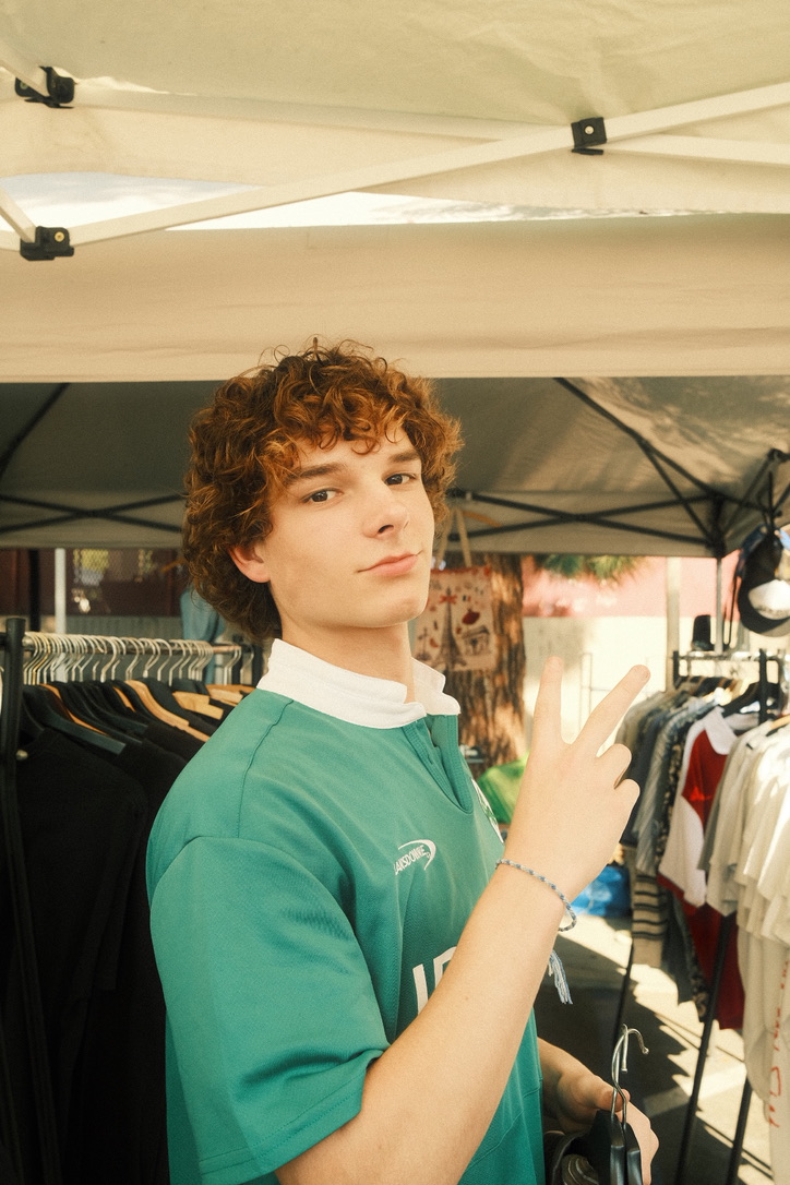 Portrait, peace sign at a market