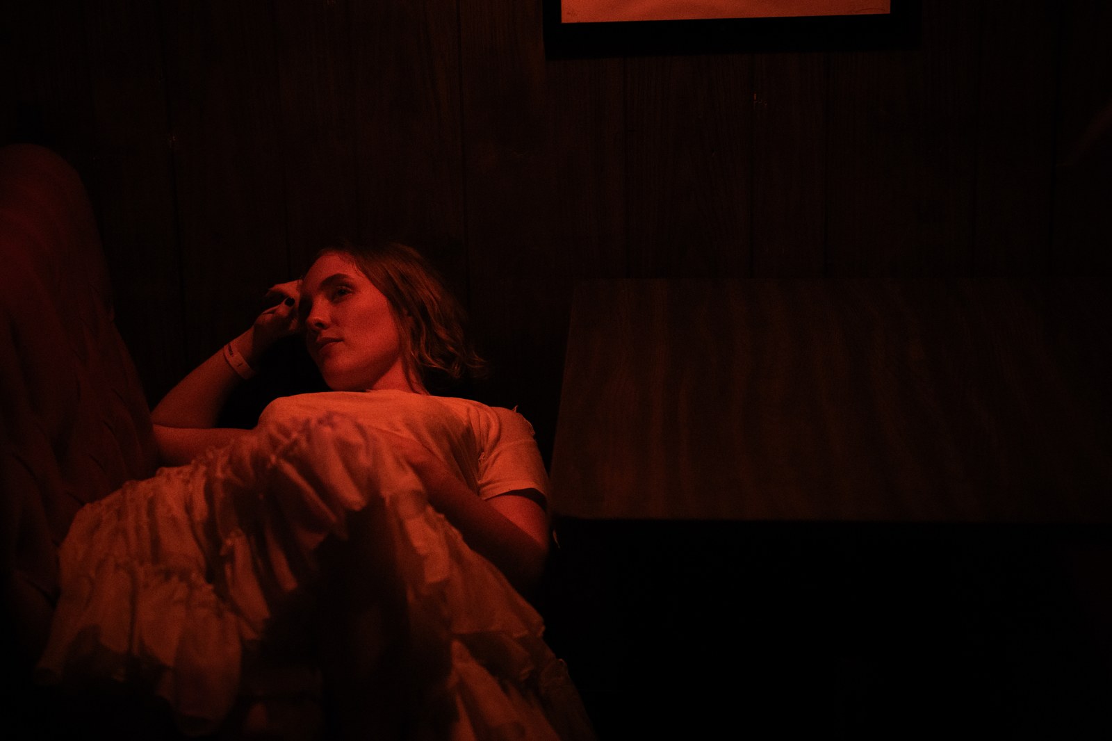 Portrait resting in red backstage light