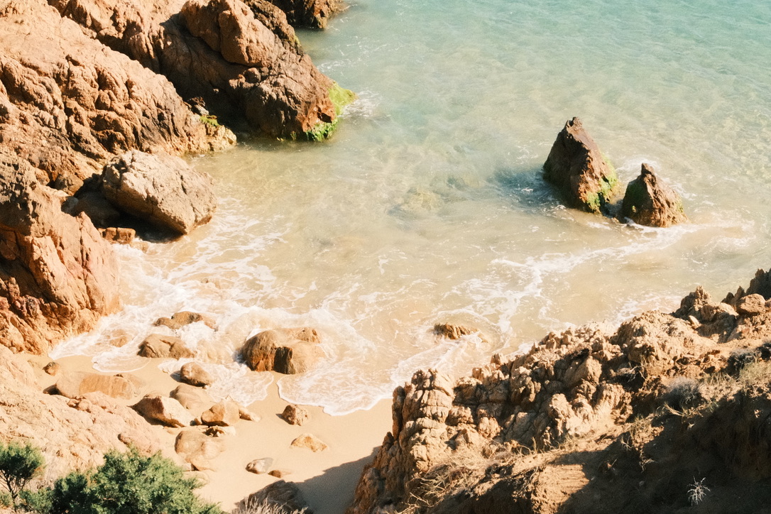 Turquoise cove with rocks