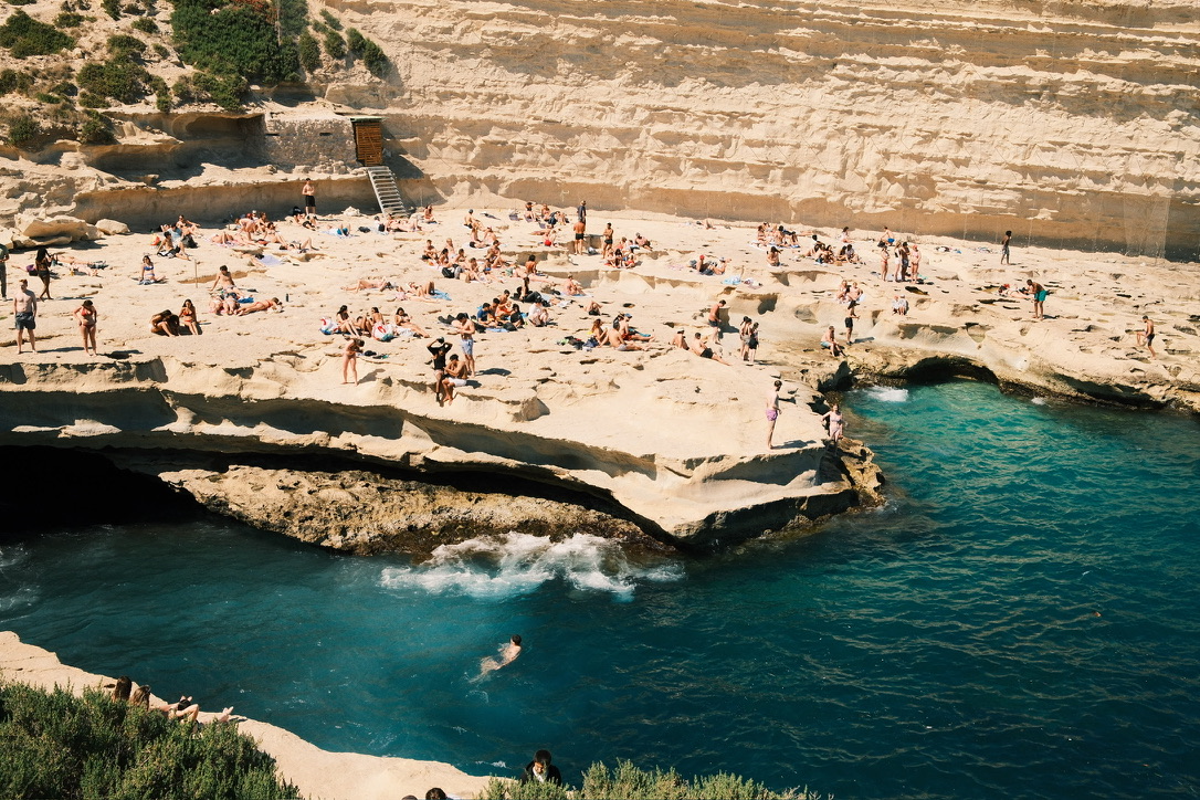 Beach cove with swimmers