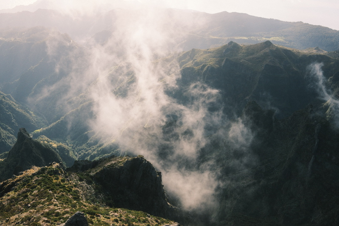 Fog rolling through mountain peaks