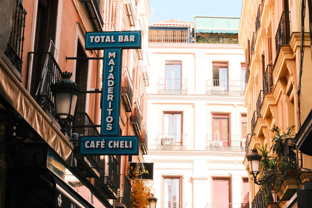 Bar signage between buildings