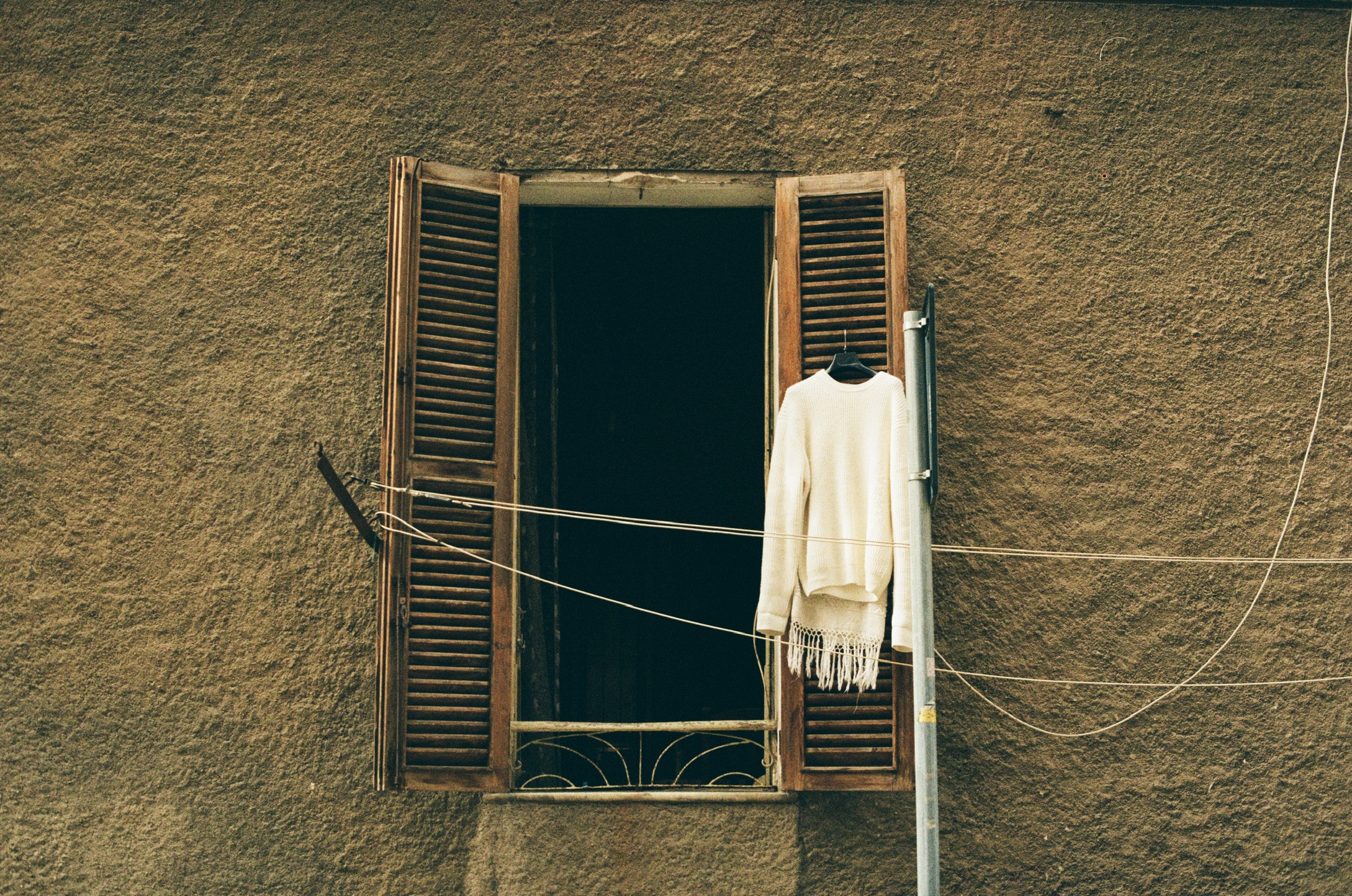 Sweater hanging in a window