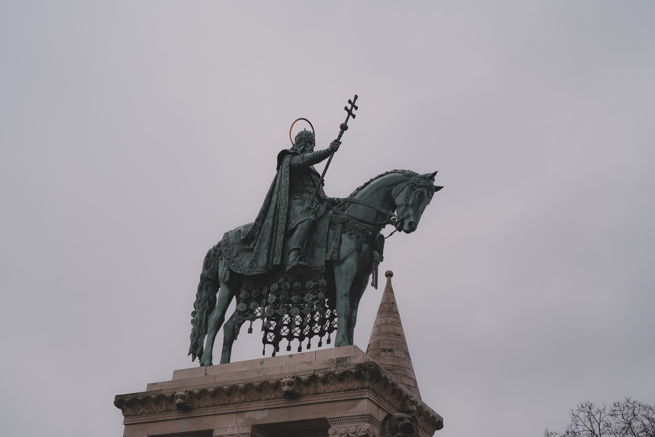 Equestrian statue against a grey sky