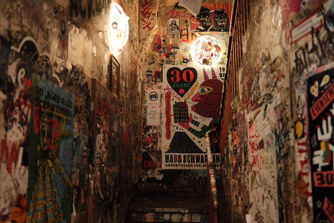 Graffiti-covered stairwell passage