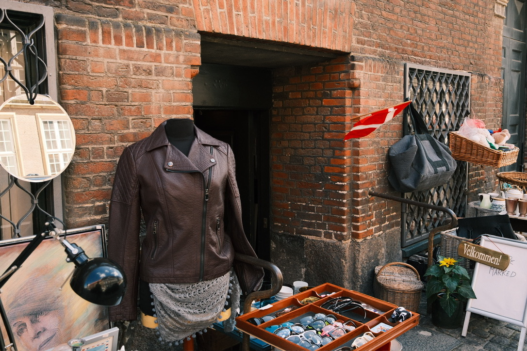 Flea market stall against a brick building